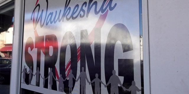 Waukesha strong signs hang throughout the community