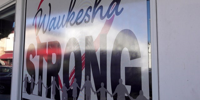TravelGuides - Waukesha parade aftermath: community comes together through fundraisers, signs and blue lights 2 Waukesha Strong signs hang throughout the community.