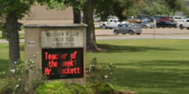The students were reportedly leaving Woodrow Wilson Junior High when someone pointed a gun at the school bus.