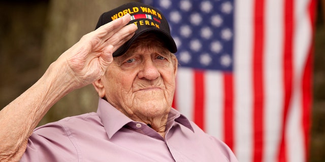 A World War II veteran is shown here with the American flag in the background. Every program of "Fox and Friends Weekend" kicks off at 6 a.m. with the playing of the national anthem as an array of original flag photos sent in by viewers are shown across the screen.