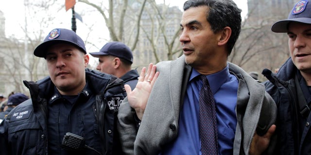 New York City Council member Ydanis Rodriguez is detained by police during a demonstration by activists against deportation outside the Jacob Javits Federal Building in Manhattan in New York City, U.S., January 11, 2018. REUTERS/Eduardo Munoz