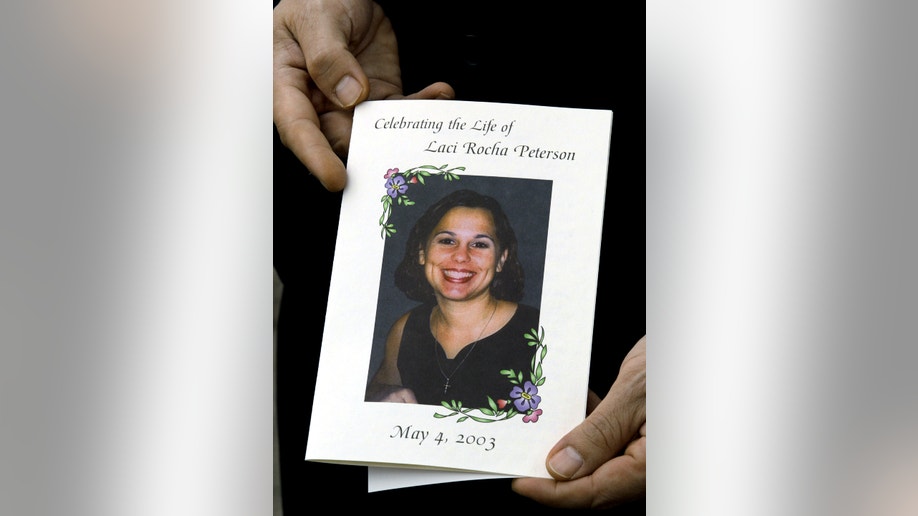 After a trial that attracted nationwide attention, California fertilizer salesman Scott Peterson, 32, was found guilty on November 12, 2004 in the Christmas Eve 2002 murder of his pregnant wife Laci. A program card from a memorial service for Laci Peterson and her unborn son is shown in this file photo taken May 4, 2003. REUTERS/Lou Dematteis LD/MR