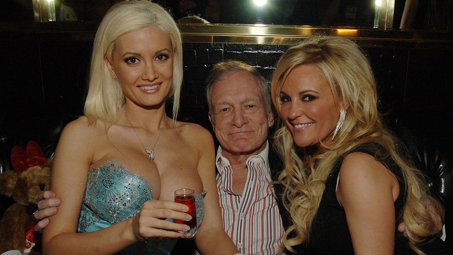 Hefner with girlfriends Holly Madison and Bridget Marquardt