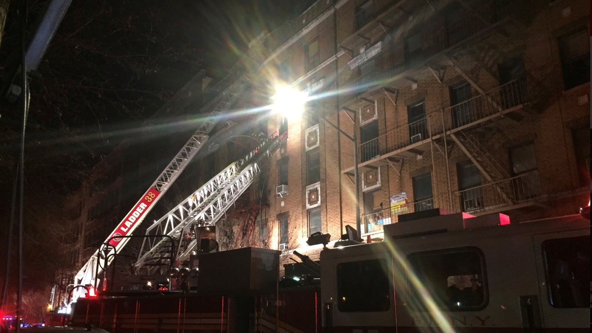 New York Fire Department ladder trucks deploy at a building fire in the Bronx borough of New York City, New York, U.S. December 28, 2017. (NYFD/Handout via REUTERS)