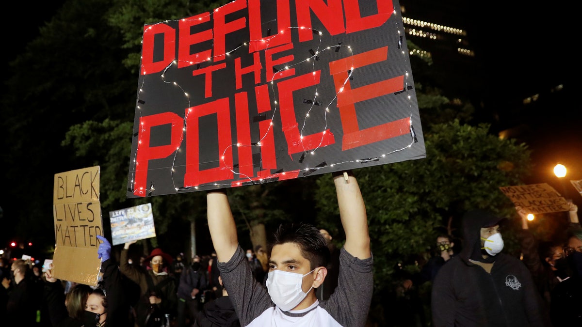Protesters rally against the death in Minneapolis police custody of George Floyd, in Portland, Oregon, June 13, 2020.