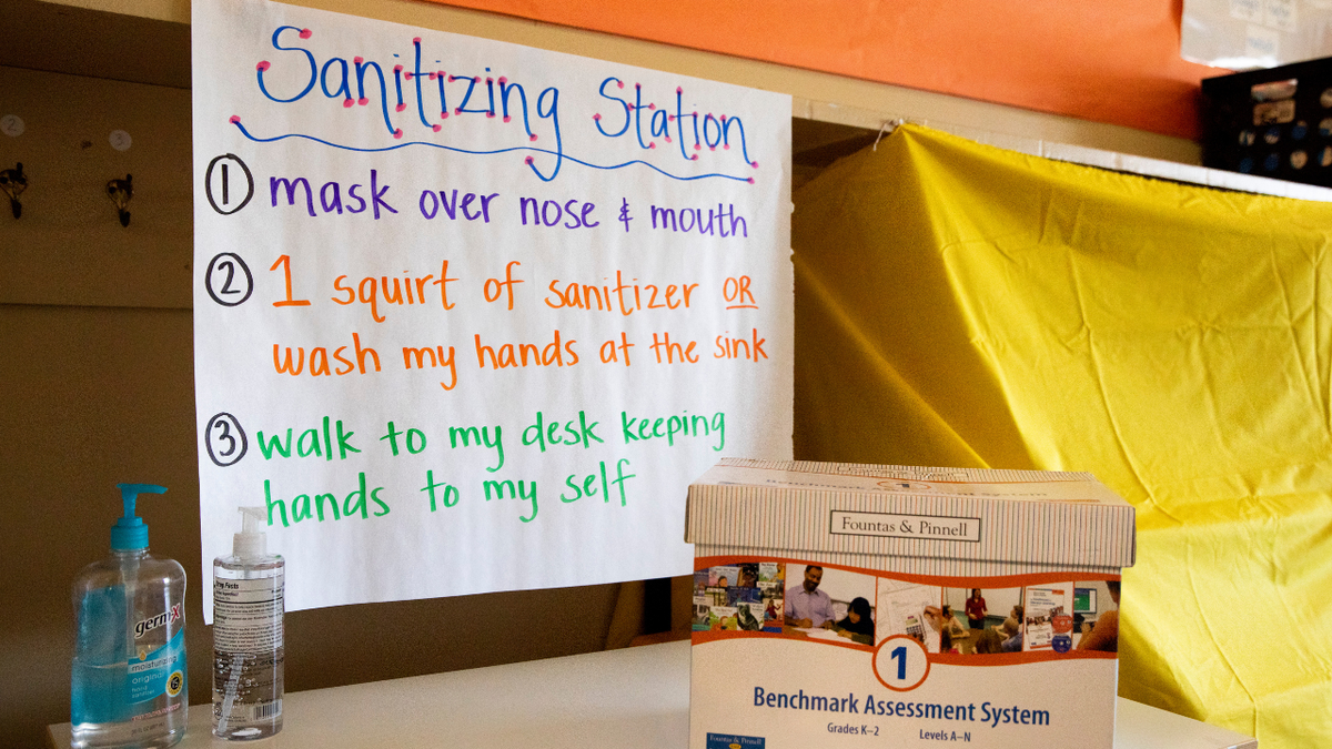 A sanitizing station sits in Catherine Fletcher's first grade classroom during the first day of partial in-person instruction at Garfield Elementary School in Oakland, Calif. (Jessica Christian/The San Francisco Chronicle via Getty Images)