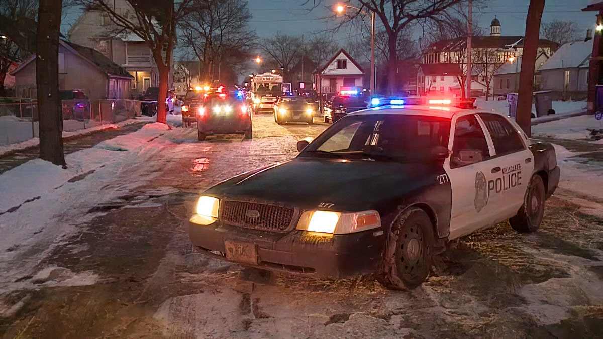 Police cars on snowy street in Milwaukee 
