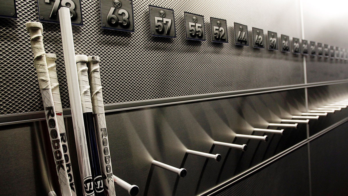A nearly empty hockey stick rack in the locker room of the Buffalo Sabres hockey team is shown during the NHL labor lockout in Buffalo, New York, Sept. 25, 2012. 