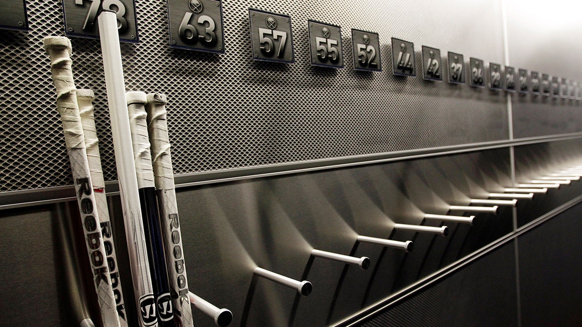 A nearly empty hockey stick rack in the locker room of the Buffalo Sabres hockey team is shown during the NHL labor lockout in Buffalo, New York, Sept. 25, 2012.