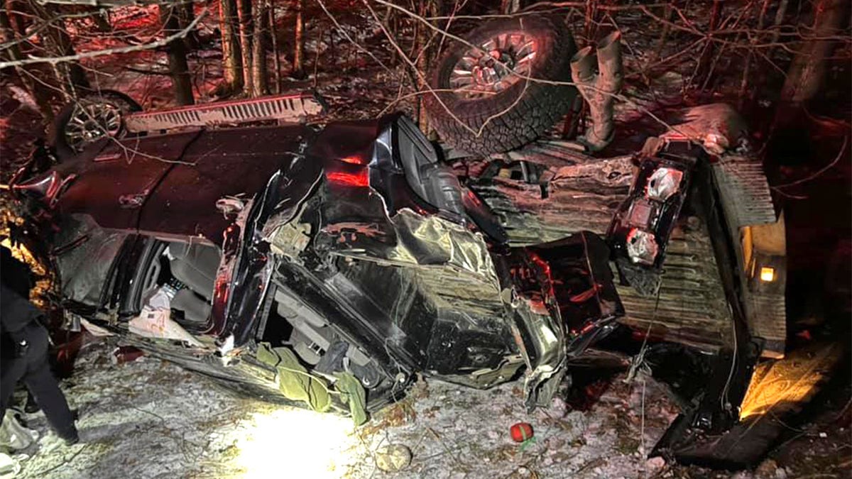 A view of the wrecked pickup after the crash, as discovered by responding officers from the New Hampshire State Police and other responding police and first-responder units. Tinsley, a young Shiloh Shepherd, led officers to this scene