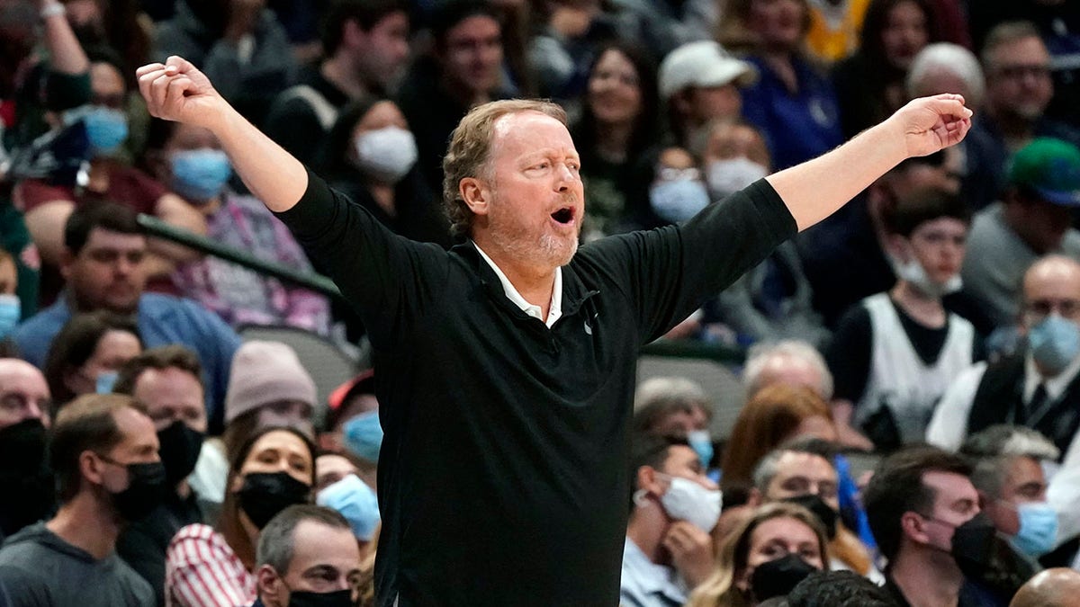 Milwaukee Bucks head coach Mike Budenholzer yells from the sidelines during the second half of an NBA basketball game against the Dallas Mavericks in Dallas, Thursday, Dec. 23, 2021. The Bucks won 102-95.