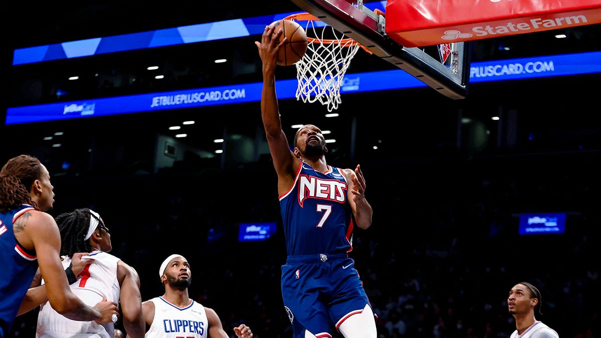 Brooklyn Nets forward Kevin Durant (7) shoots against the Los Angeles Clippers during the first half of an NBA basketball game Saturday, Jan. 1, 2022, in New York.
