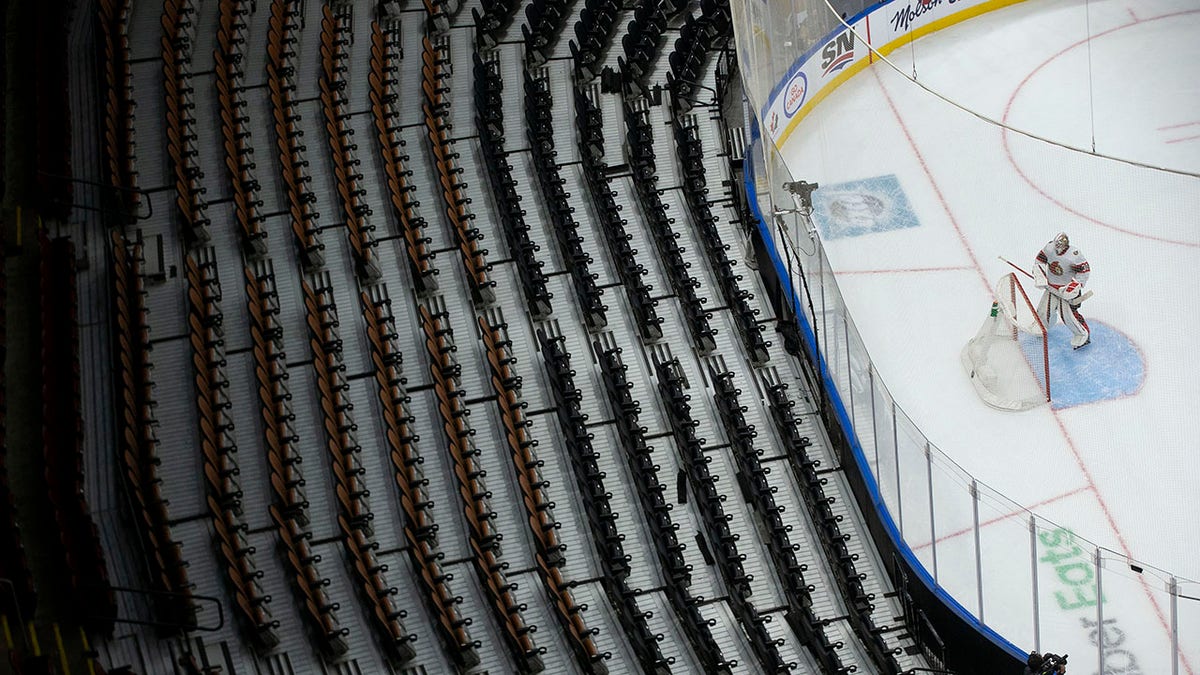 Ottawa Senators goaltender Matt Murray turns to face a bank of empty seats at the Scotiabank Arena during the first period of an NHL hockey game against the Toronto Maple Leafs, in Toronto, Saturday, Jan. 1, 2022. The Ontario Government reduced capacity at sporting events to a maximum of 1000 in a bid to stem the spread of the COVID-19 Omicron variant.