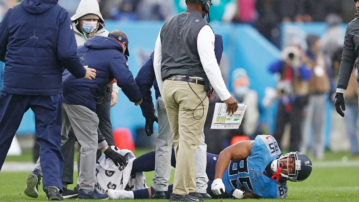 Tennessee Titans tight end MyCole Pruitt (85) is attended to after being injured in the first half of an NFL football game against the Miami Dolphins Sunday, Jan. 2, 2022, in Nashville, Tenn.
