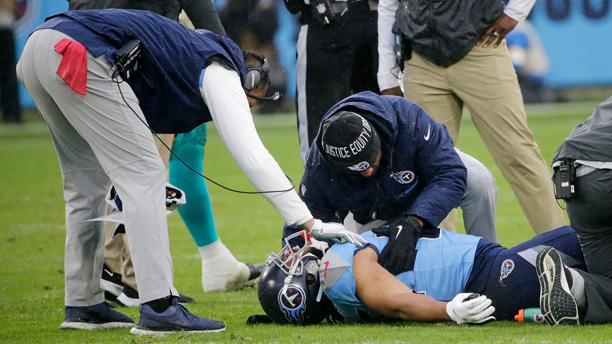Tennessee Titans tight end MyCole Pruitt is attended to after being injured in the first half of an NFL football game against the Miami Dolphins Sunday, Jan. 2, 2022, in Nashville, Tenn.