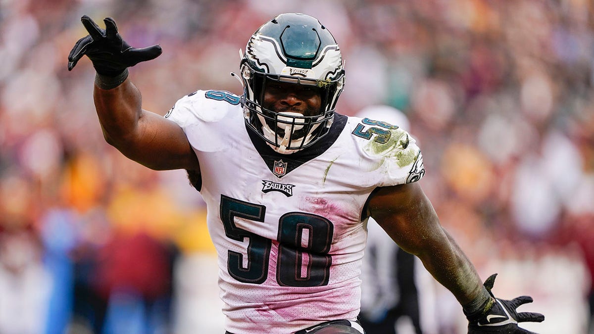 Philadelphia Eagles outside linebacker Genard Avery (58) celebrates after sacking Washington Football Team quarterback Taylor Heinicke (4) during the second half of an NFL football game, Sunday, Jan. 2, 2022, in Landover, Md.