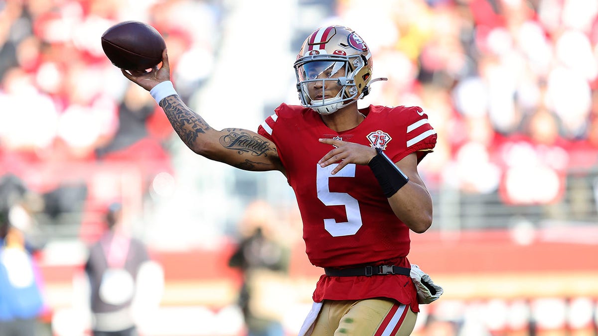 San Francisco 49ers quarterback Trey Lance (5) passes against the Houston Texans during the first half of an NFL football game in Santa Clara, Calif., Sunday, Jan. 2, 2022.