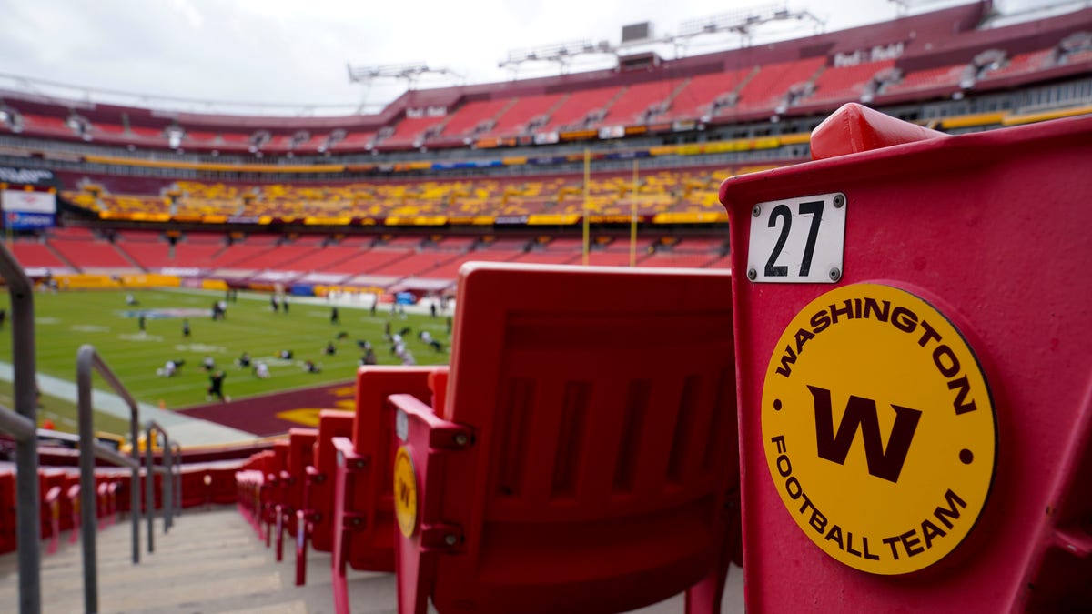 Seats at Fedex Field display the Washington Football Team logo during pregame warmups of an NFL football game between Washington Football Team and Philadelphia Eagles