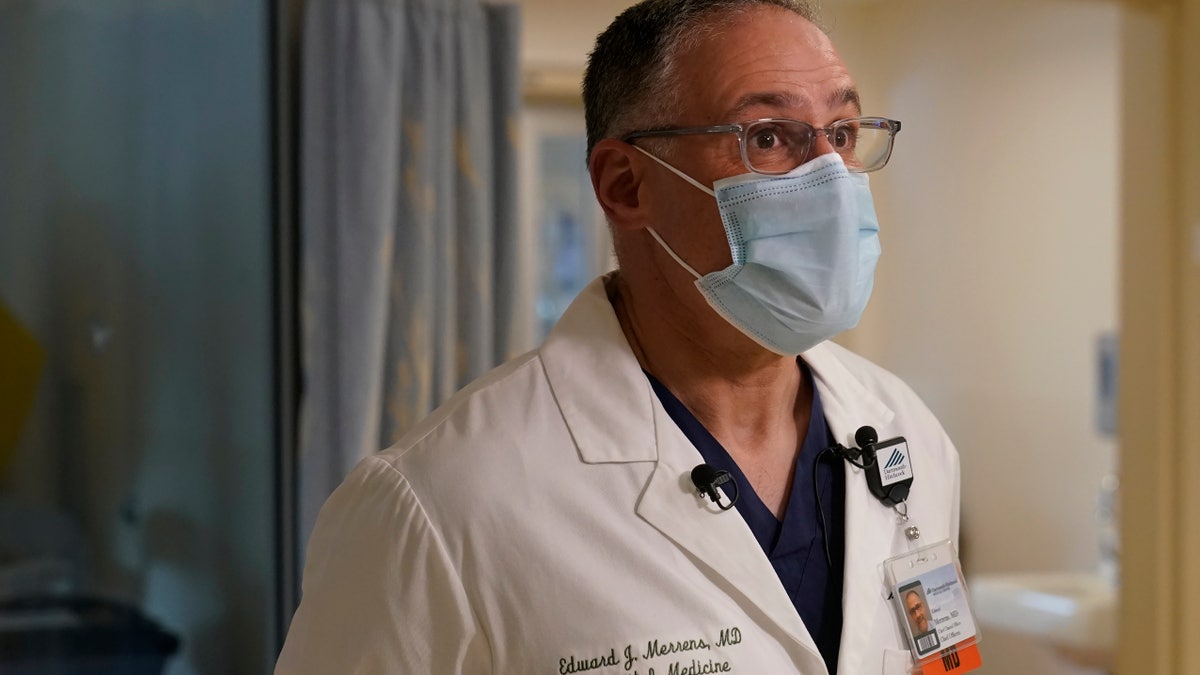 Edward Merrens, a chief clinical officer, is interviewed by The Associated Press, in the COVID-19 Intensive Care Unit at Dartmouth-Hitchcock Medical Center, in Lebanon, N.H., Monday, Jan. 3, 2022. (AP Photo/Steven Senne)