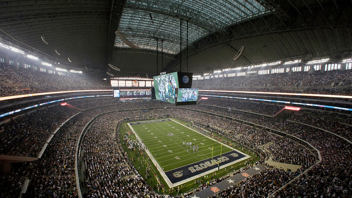 Fans watch at the start of an NFL football game inside AT&amp;T Stadium between the New York Giants and Dallas Cowboys, Sunday, Sept. 8, 2013, in Arlington, Texas. 