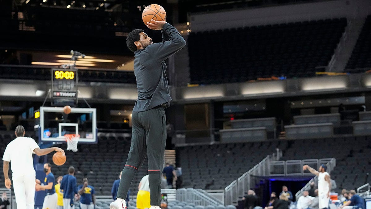 Brooklyn Nets' Kyrie Irving shoots before the team's NBA basketball game against the Indiana Pacers, Wednesday, Jan. 5, 2022, in Indianapolis.