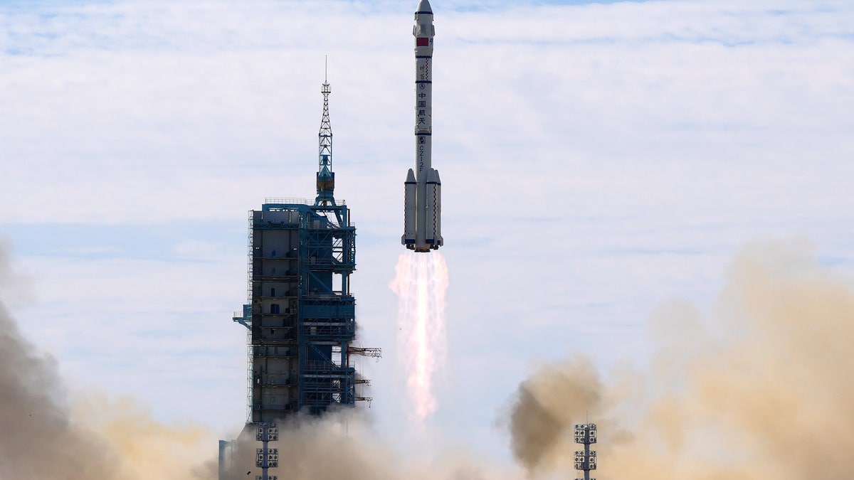 A Long March-2F Y12 rocket carrying a crew of Chinese astronauts in a Shenzhou-12 spaceship lifts off at the Jiuquan Satellite Launch Center in Jiuquan in northwestern China, Thursday, June 17, 2021. (AP Photo/Ng Han Guan, File)