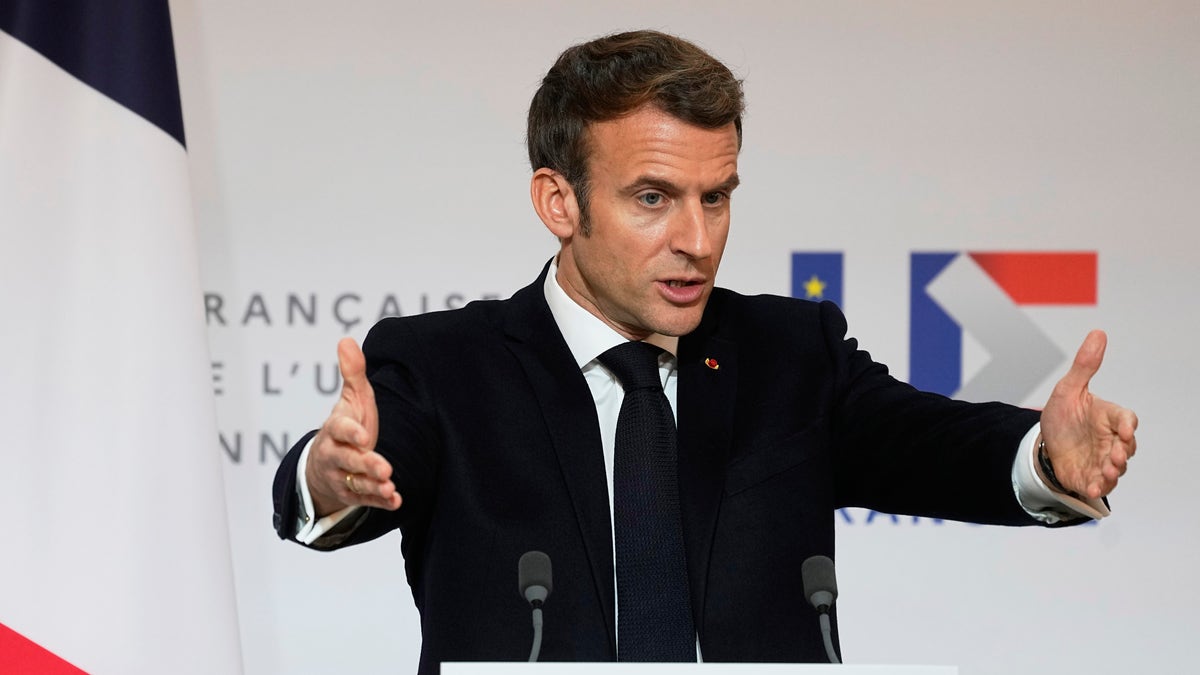 French President Emmanuel Macron speaks as he participates in a media conference with European Commission President Ursula von der Leyen after a meeting at the Elysee Palace in Paris, France, Friday, Jan. 7, 2022. (AP Photo/Michel Euler, Pool)