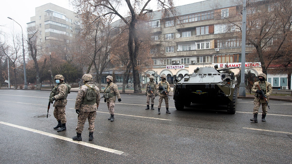 Kazakhstan soldiers patrol a street after clashes in Almaty, Kazakhstan, Friday, Jan. 7, 2022. (Associated Press)