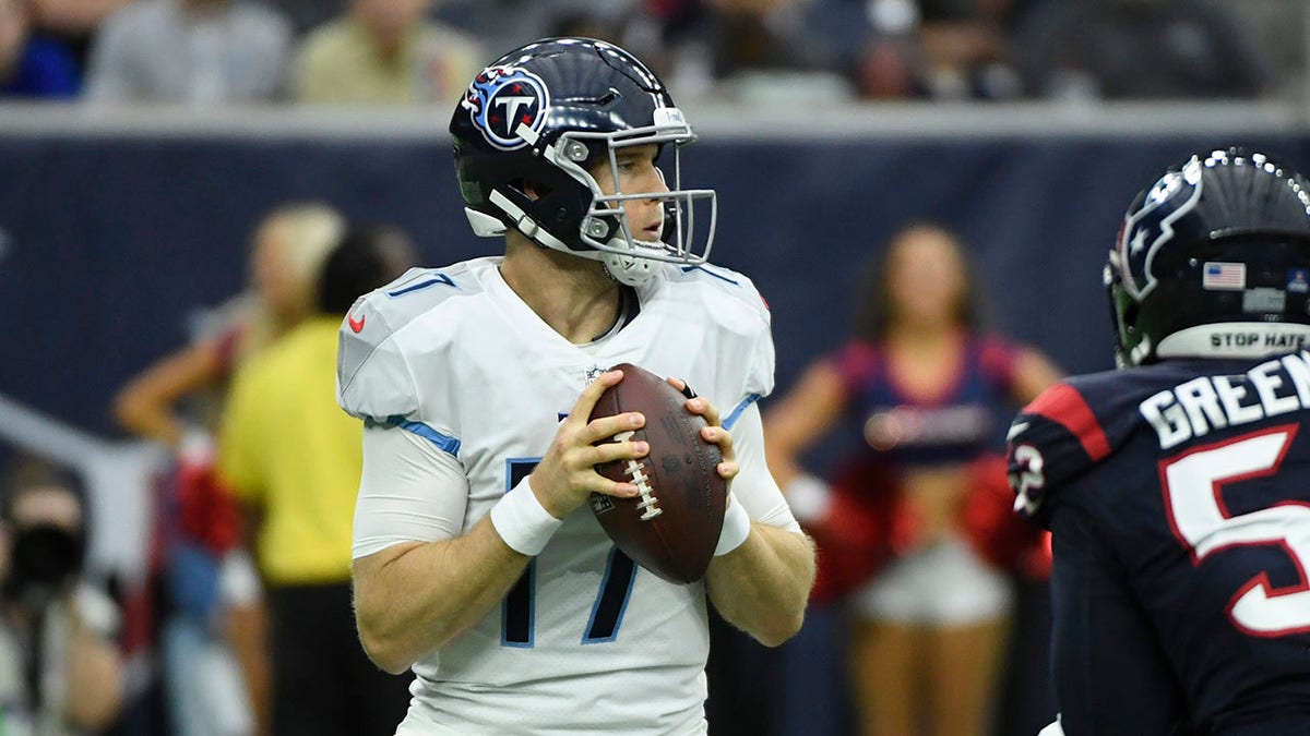 Tennessee Titans quarterback Ryan Tannehill (17) looks to throw against the Houston Texans during the first half of an NFL football game, Sunday, Jan. 9, 2022, in Houston.