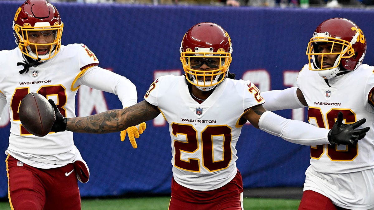 Washington Football Team cornerback Bobby McCain (20) reacts after returning an interception for a touchdown against the New York Giants during the third quarter of an NFL football game, Saturday, Jan. 9, 2021, in East Rutherford, N.J.