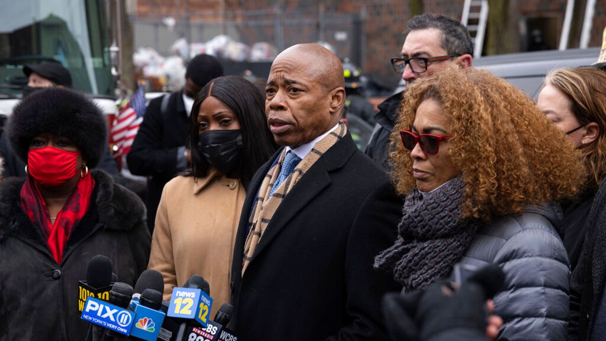 New York City Mayor Eric Adams speaks during a news conference outside an apartment building where a deadly fire occurred in the Bronx on Sunday, Jan. 9, 2022. (AP Photo/Yuki Iwamura)