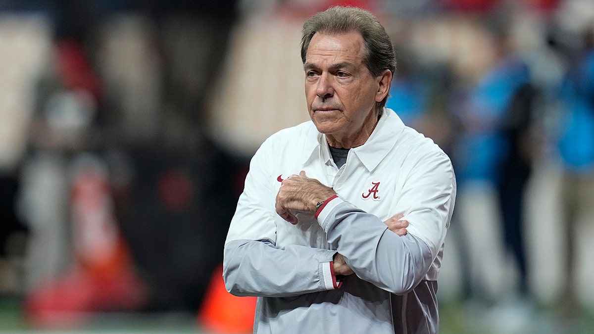 Nick Saban watches warm ups