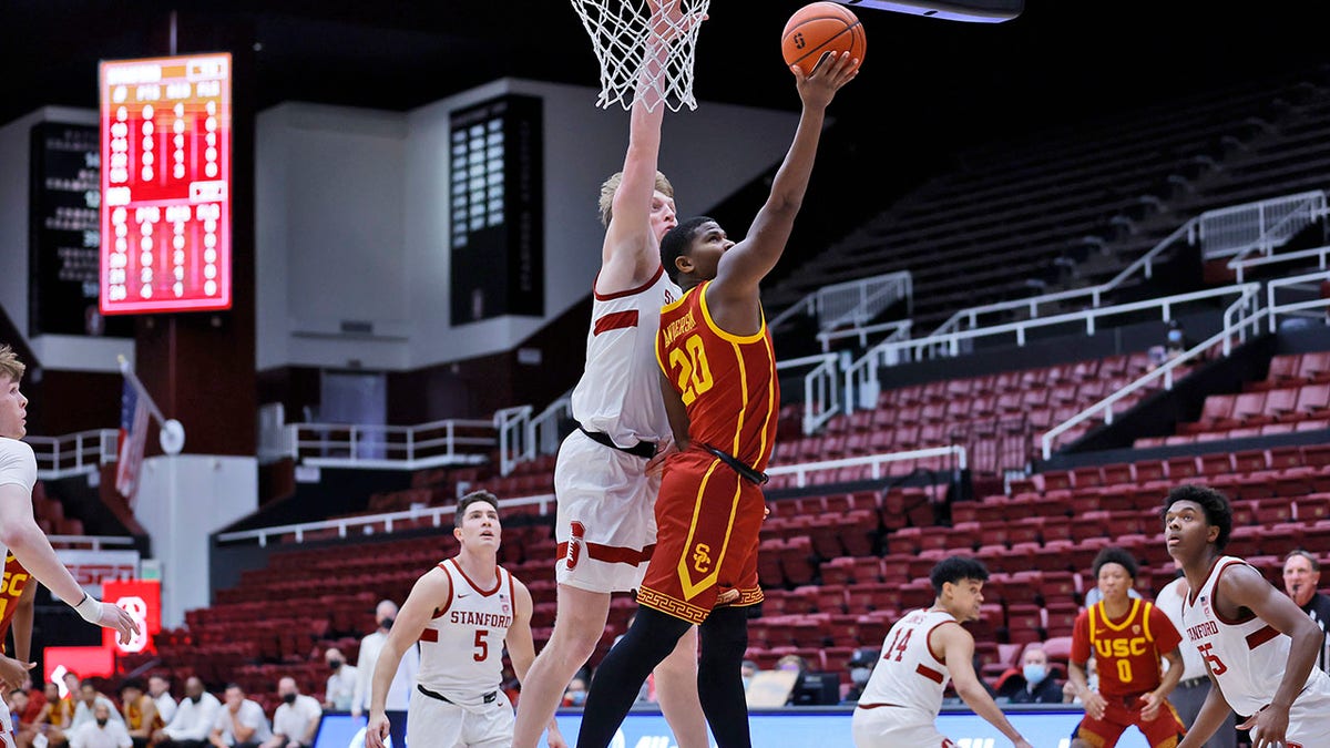 Stanford forward James Keefe (22) defends as Southern California guard Ethan Anderson (20) aims for the basket during the first half of an NCAA college basketball game Tuesday, Jan. 11, 2022, in Stanford, Calif.