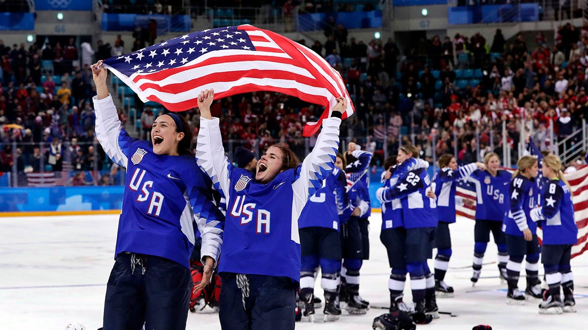 FILE - United States players celebrate after winning the women's gold medal hockey game against Canada at the 2018 Winter Olympics in Gangneung, South Korea, Feb. 22, 2018. The United States is the defending Olympic champion after beating Canada in an exceptionally nail-biting 3-2 shootout win at South Korea to end Canada's run of four gold medals.