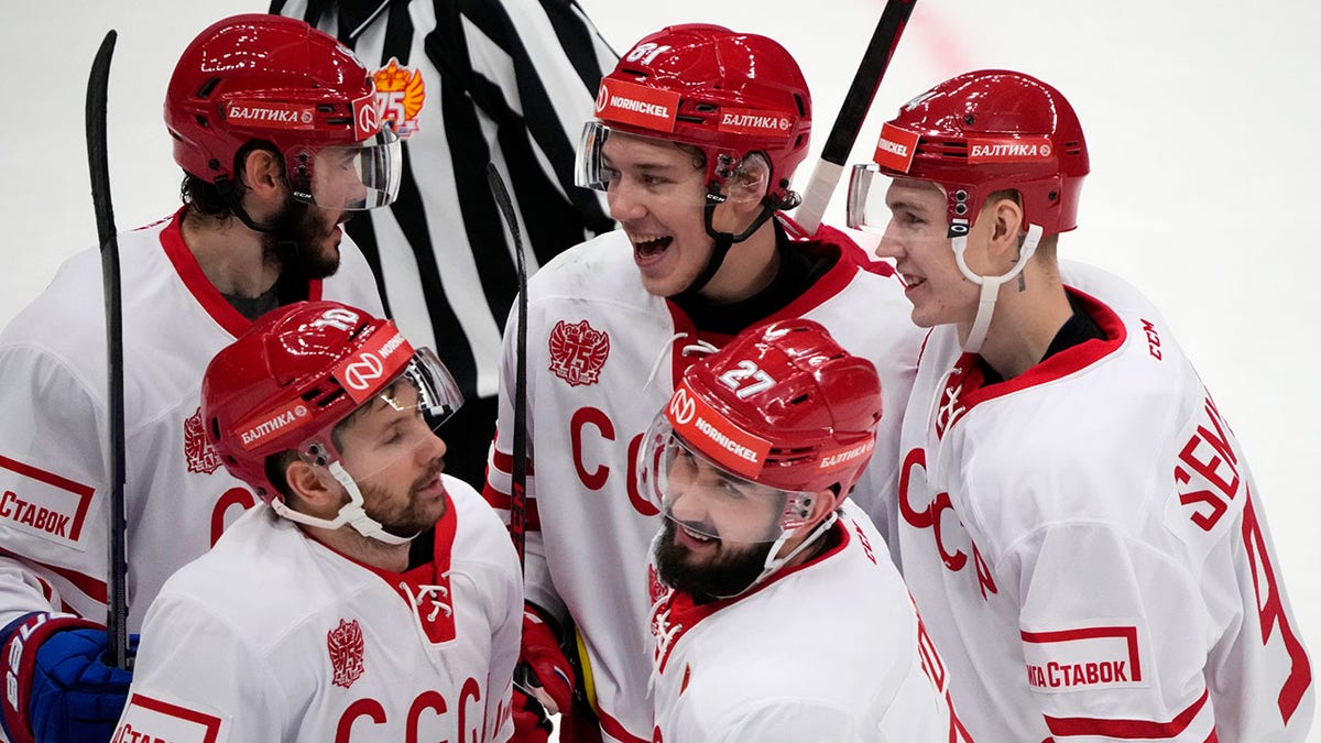 FILE - Russia's Vyacheslav Voynov (27) celebrates with his teammates after scoring his side's second goal during the Channel One Cup ice hockey match between Russia and Finland in Moscow, Russia, Sunday, Dec. 19, 2021. Former Los Angeles Kings defenseman Slava Voynov and the Russians are favored once again at the Olympics without NHL players. Voynov was part of the "Olympic Athletes from Russia" team that won gold in 2018 in Pyeongchang.