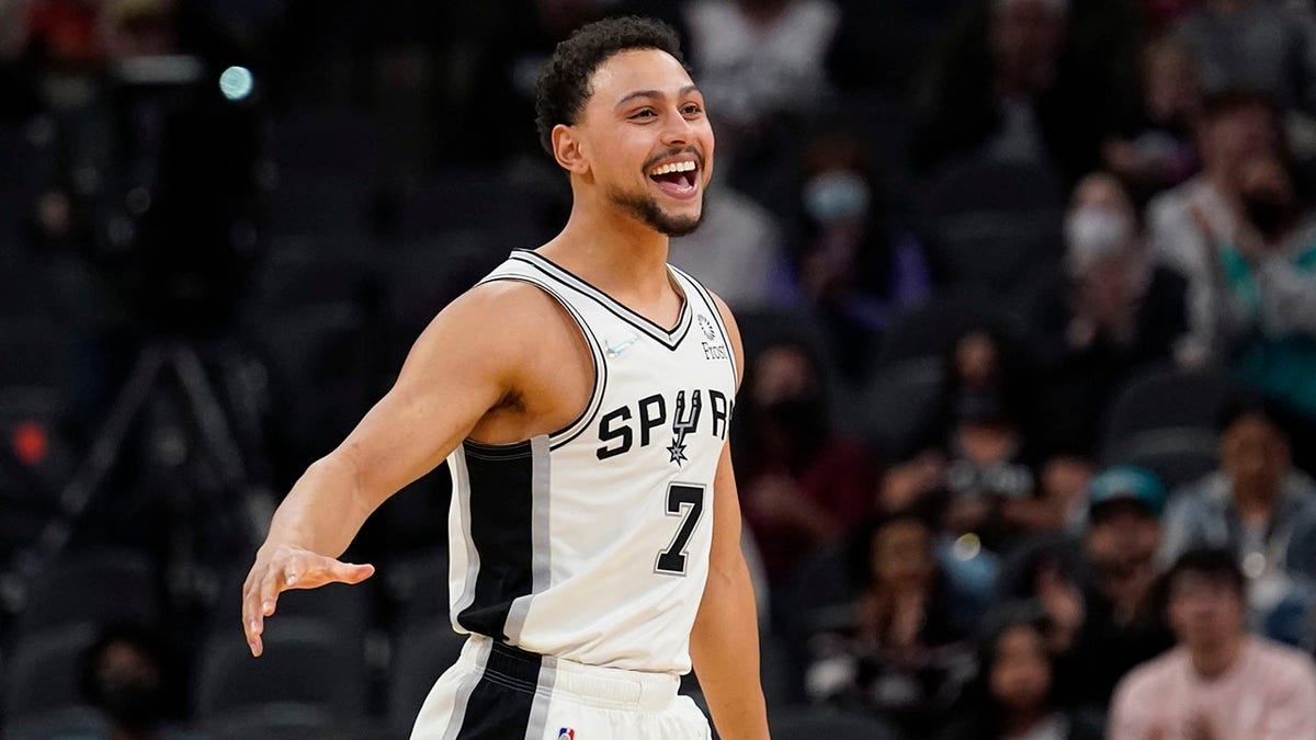 San Antonio Spurs guard Bryn Forbes (7) reacts to a score against the Houston Rockets during the second half of an NBA basketball game, Wednesday, Jan. 12, 2022, in San Antonio.