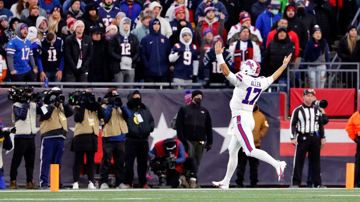 FILE - Buffalo Bills quarterback Josh Allen (17) celebrates in front of fans in Foxborough, Mass., after a touchdown by tight end Dawson Knox during the second half of an NFL football game, Sunday, Dec. 26, 2021. The Bills beat the Patriots 33-21. Bill Belichick and the New England Patriots dominated the Buffalo Bills from 2000 to 2019, it was difficult to dub it a rivalry. The tables finally seem to be turning in the AFC East, with Buffalo having won three of four and consecutive division titles, in preparing to host New England in a wild-card playoff on Saturday night.