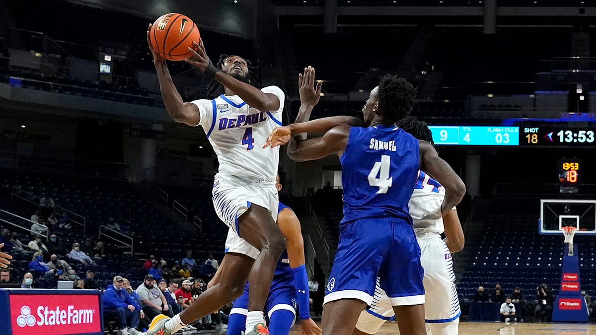 DePaul's Javon Freeman-Liberty (4) drives to the basket past Seton Hall's Tyrese Samuel (4) during the first half of an NCAA college basketball game Thursday, Jan. 13, 2022, in Chicago.