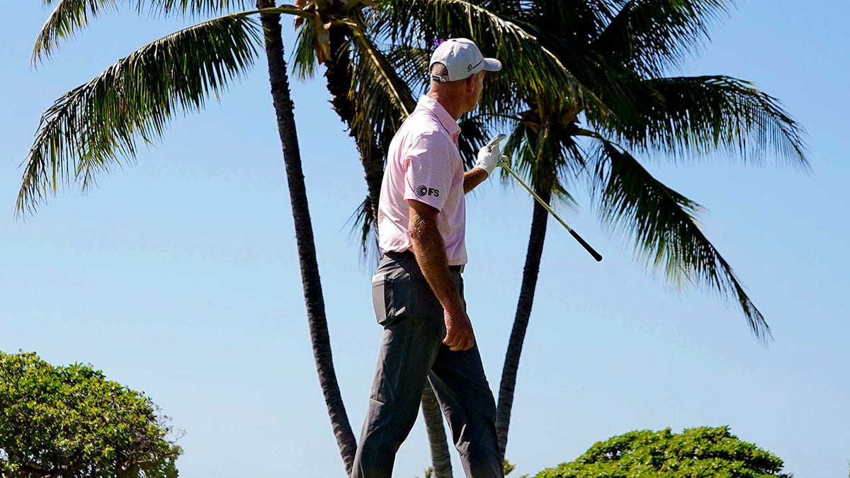 Jim Furyk watches his tee shot from the 17th tee drop into the cup for a hole-in-one during the first round of the Sony Open golf tournament, Thursday, Jan. 13, 2022, at Waialae Country Club in Honolulu.