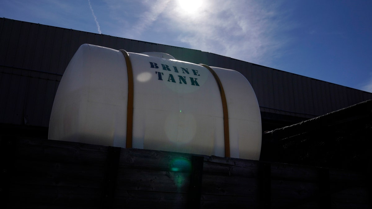 A Georgia Department of Transportation brine tank is seen atop a truck, ahead of a winter storm at the GDOT's Maintenance Activities Unit location on Friday, Jan. 14, 2022, in Forest Park, Ga. (AP Photo/Brynn Anderson)