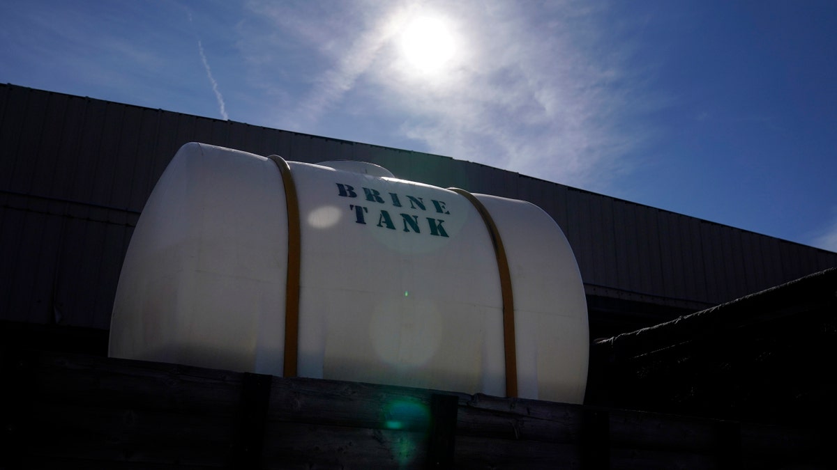 A Georgia Department of Transportation brine tank is seen atop a truck, ahead of a winter storm at the GDOT's Maintenance Activities Unit location on Friday, Jan. 14, 2022, in Forest Park, Ga. (AP Photo/Brynn Anderson)