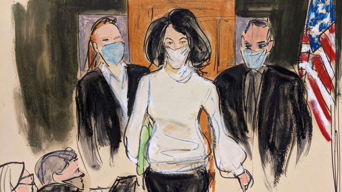 In this courtroom sketch, Ghislaine Maxwell enters the courtroom escorted by U.S. Marshalls at the start of her trial, Monday, Nov. 29, 2021, in New York (AP Photo/Elizabeth Williams, File)