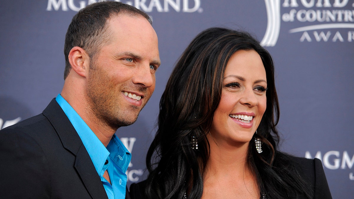 Jay Barker and his wife, Sara Evans