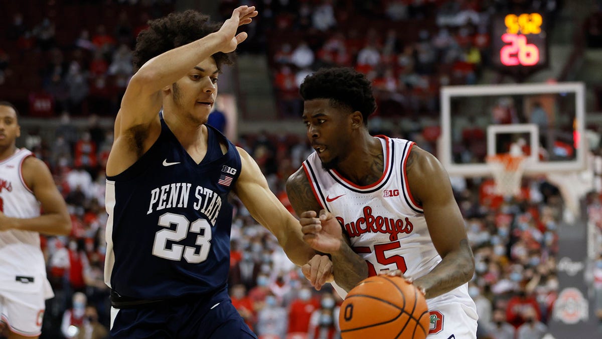 Ohio State's Jamari Wheeler, right, brings the ball up court as Penn State's Dallion Johnson defends during the second half of an NCAA college basketball game Sunday, Jan. 16, 2022, in Columbus, Ohio.