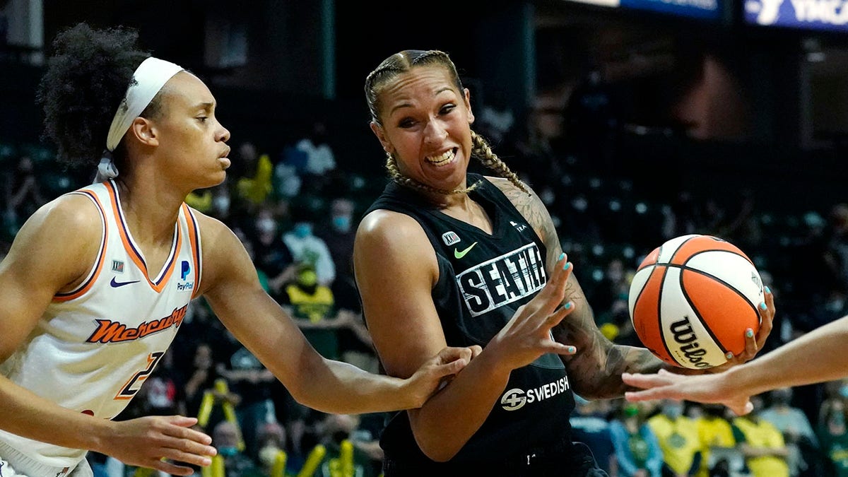 FILE - Seattle Storm's Mercedes Russell, right, drives against Phoenix Mercury's Megan Walker in the first half of the second round of the WNBA basketball playoffs, Sunday, Sept. 26, 2021, in Everett, Wash. Kelsey Mitchell, Lexie Brown and Mercedes Russell were the latest three WNBA players to sign up for the inaugural Athletes Unlimited Basketball season.