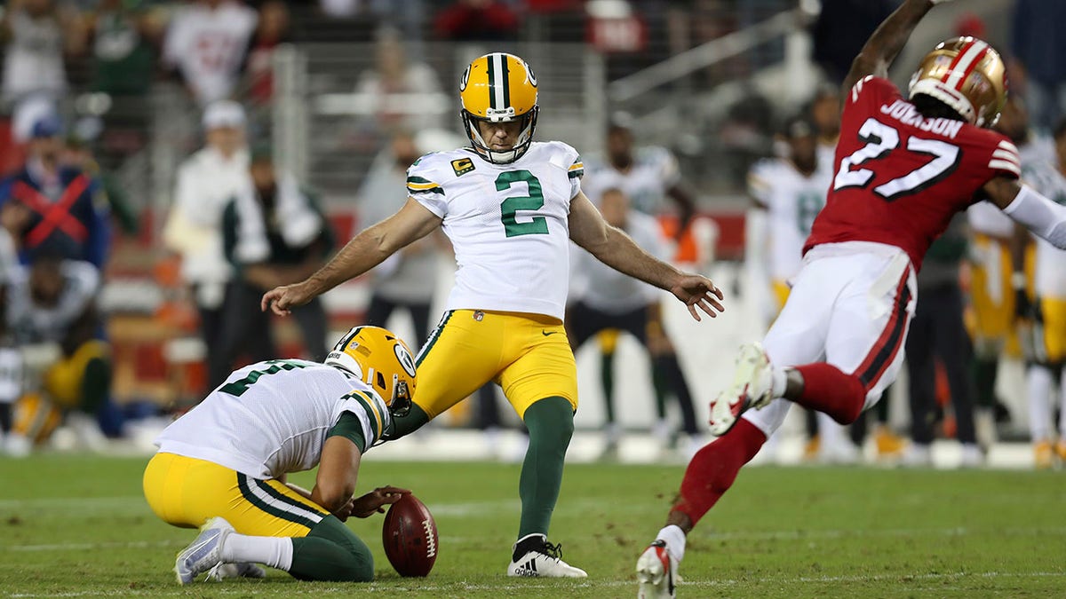 FILE -Green Bay Packers kicker Mason Crosby (2) kicks the game winning field goal from the hold of Corey Bojorquez during the second half of an NFL football game against the San Francisco 49ers in Santa Clara, Calif., Sunday, Sept. 26, 2021. The Packers and 49er meet Saturday, Jan. 22, 2022.