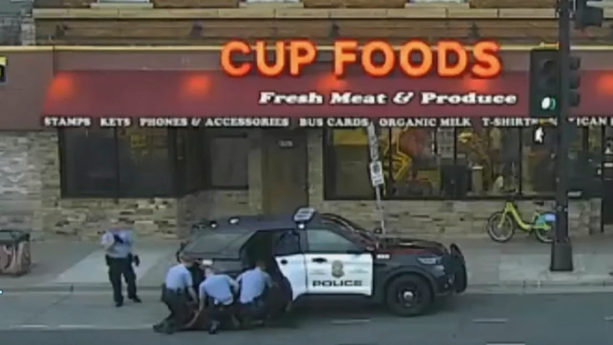 In this image from surveillance video, Minneapolis police Officers from left, Tou Thao, Derek Chauvin, J. Alexander Kueng and Thomas Lane are seen attempting to take George Floyd into custody in Minneapolis, Minn on May 25, 2020.