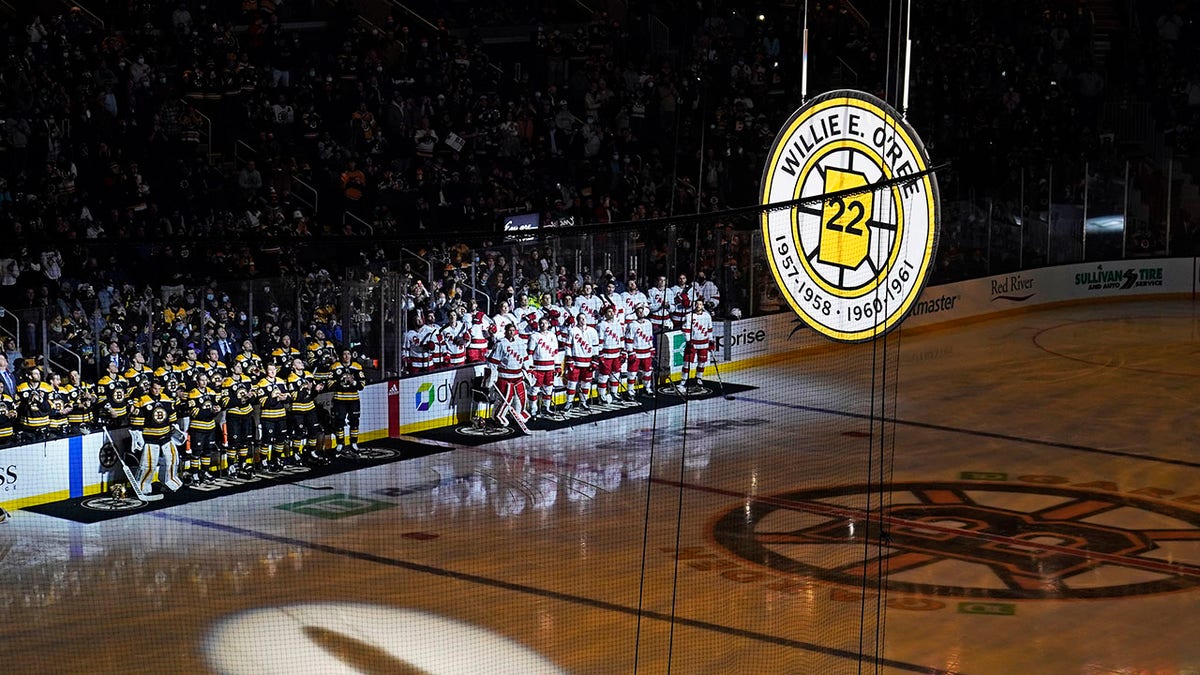The #22 of Boston Bruin Willie O'Ree is hoisted to the rafters of the TD Boston Garden during a ceremony prior to an NHL hockey game, Tuesday, Jan. 18, 2022, in Boston. O'Ree, the NHL's first Black player, attended the ceremony remotely via video.