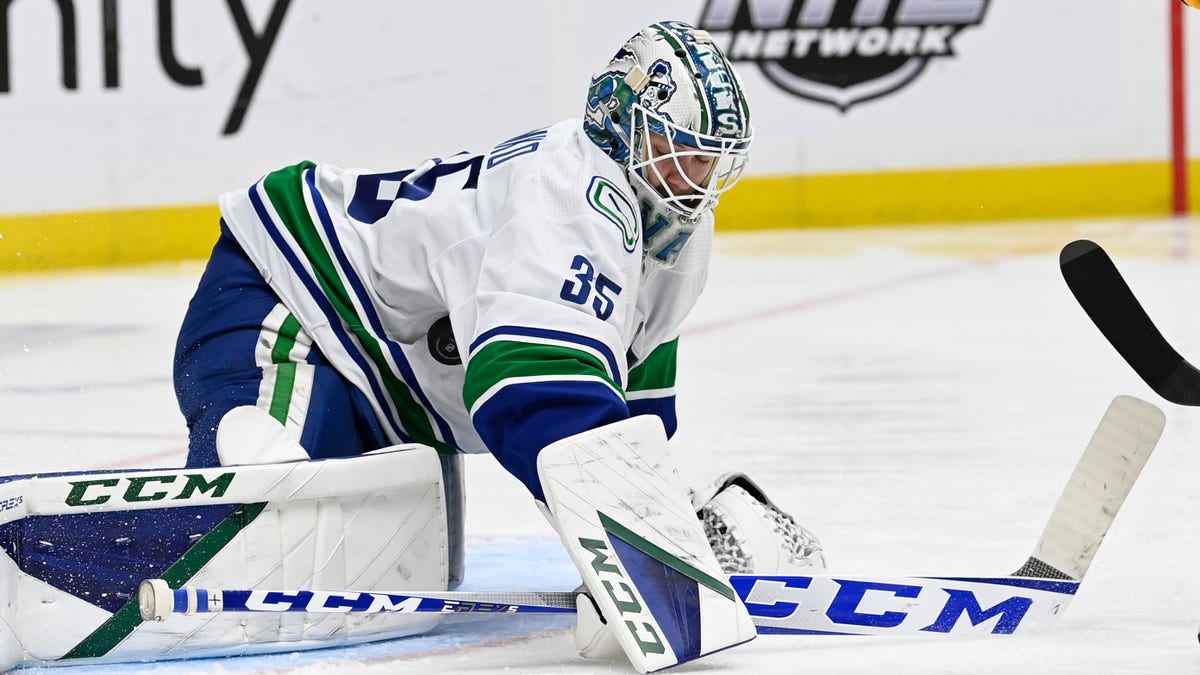 Vancouver Canucks goaltender Thatcher Demko (35) stops a shot by the Nashville Predators during the second period of an NHL hockey game Tuesday, Jan. 18, 2022, in Nashville, Tenn. 