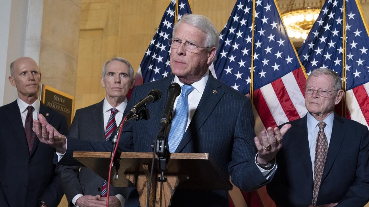 Sen. Roger Wicker, R-Miss., center, accompanied by Sen. Rick Scott, R-Fla., Sen. Rob Portman, R-Ohio, and Sen. Jim Inhofe, R-Okla. speaks during the Senate Armed Services and Senate Foreign Relations GOP news conference on Capitol Hill in Washington, Wednesday, Jan. 19, 2022. 